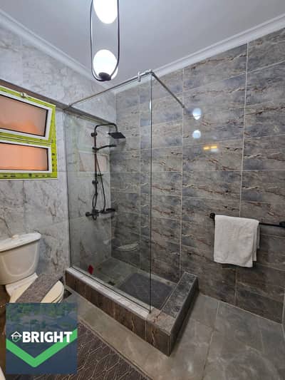 An exceptional apartment, hotel-style finishing, fully equipped with a kitchen and ACs. Located in the Kattameya Gardens Fifth Settlement new cairo