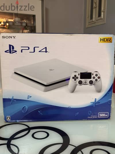 PS4 slim online (white ) Like new with box  With two controllers