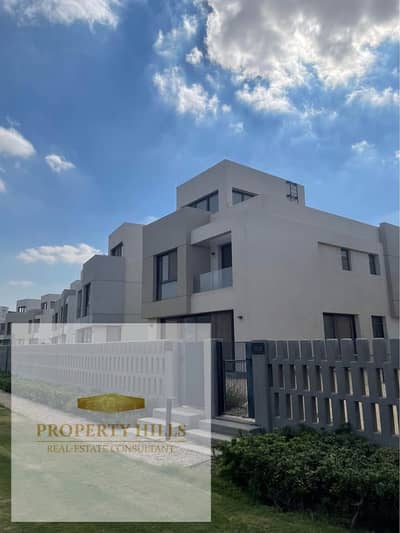 Fully finished villa for sale in Al Shorouk, overlooking a large landscaped garden.