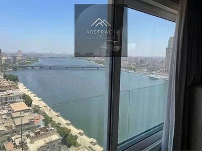 جناح فندقي فاخر من انتركونتننتال متشطب و مفروش بالكامل بالاجهزه صف اول علي كورنيش النيل و بفيو الاهرامات في ابراج REVE DU NIL بعائد سنوي 1.2 مليون