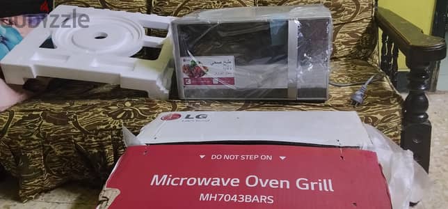 ميكروويف LG Grill زيرو بالكرتونة ولم يُستخدم نهائياً.