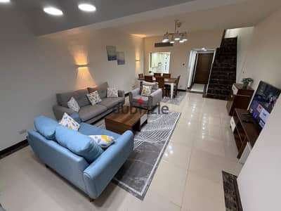 Furnished duplex for rent in Neom New Cairo, directly facing AUC on 90th St. Luxury living with prime view!