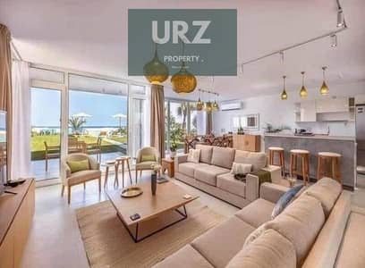 For sale in  a ground floor chalet with a private garden, fully finished, high quality, with a full panoramic sea view