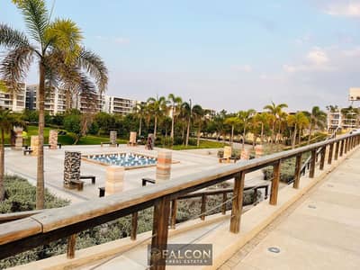 An apartment in a prime location at the Taj City compound, directly on Suez Road, with a down payment of only 570,000 and a 10-year interest-free inst