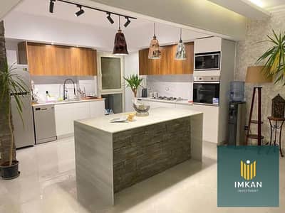 Apartment for sale in Regents Square Compound, Fifth Settlement (near Al Ahly Club), with a 1 million EGP down payment. It is fully finished and overl