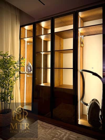 Furnished apartment for rent with ultra-super-luxury finishing, located in a prime location next to the East Market and Gate 23, featuring an open gar