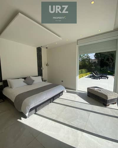 Standalone villa for sale in installments over 10 years with a private pool and 50% on the Suez Road next to SODIC in front of Madinaty