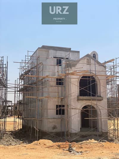 Corner villa with 5 bedrooms and 3 floors featuring a panoramic view for sale on Suez Road near AUC Mountain View Jayd Taj City  Madinaty