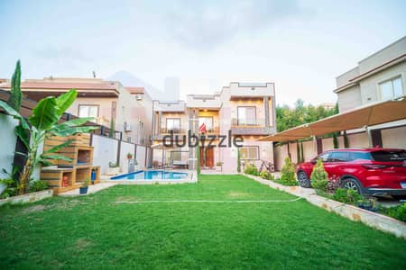 Villa for sale (170m² built-up area + 500m² land) – King Mariout, Main Omar Al-Mukhtar Street
