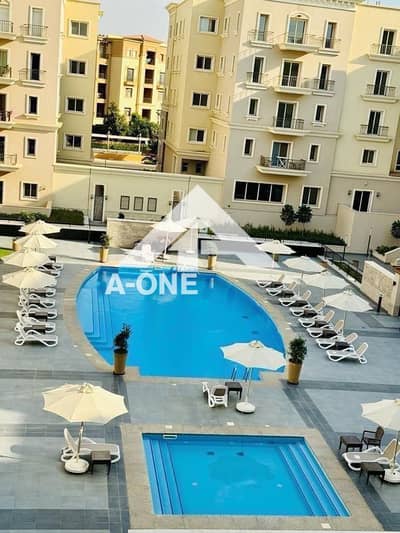 Apartment with a direct view of the swimming pool and the landscape A luxurious apartment for rent in Boulevard Mivida Fifth Settlement