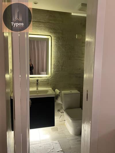 Apartment for sale in Al-Khamayel Compound, Sheikh Zayed. Ultra-super-lux finish, first-floor unit (one level above ground), north-facing with an open