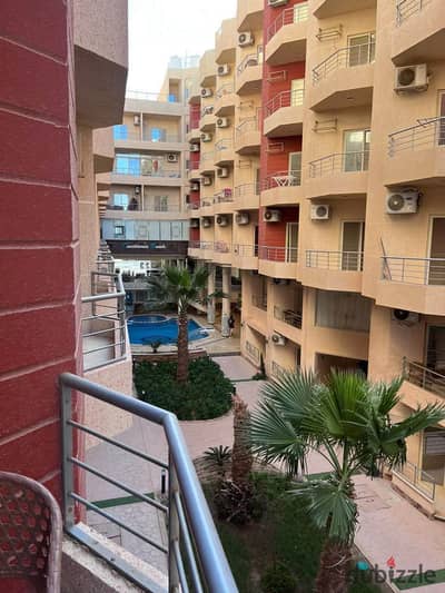 Furnished, air-conditioned apartment for sale directly on the sea in Hurghada, featuring a private beach.