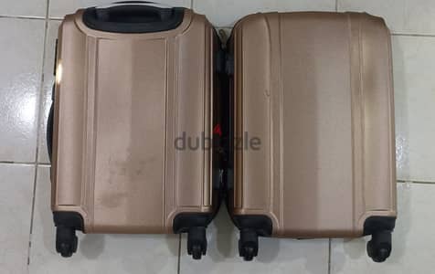 Preloved Pink metallic 50x35x22cm luggage spinning wheel EGP 1,222nego