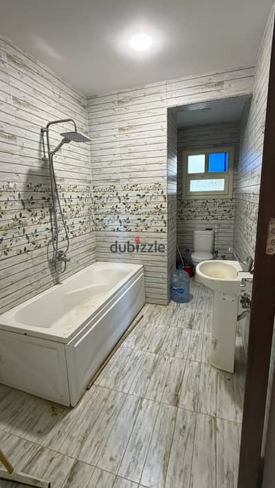 Apartment for sale with a garden view, finished, in the third district, east of Al-Shorouk City, at a bargain price