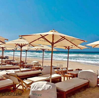 Chalet with a distinctive view overlooking the lagoon, 100m, fully finished, in Sea Shore Ras El Hekma, next to Playa