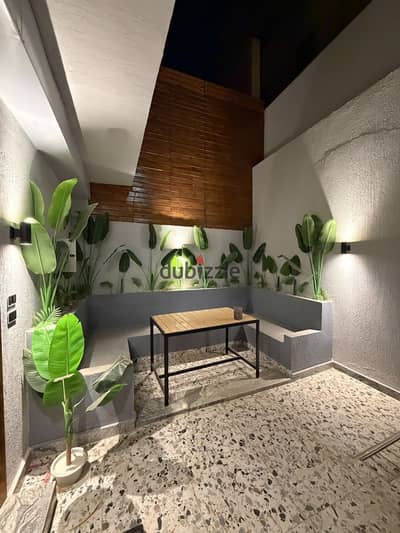 Basement for sale in Narges 8 Villas, ultra super lux finishing with a private entrance and private garden, area 210 sqm including kitchen and air conditioners.