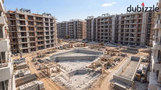 Ground apartment with garden in ROVAN CITY compound, Sheikh Zayed, Street 2, next to Cairo Gate for real estate and in front of Smart Village, steps to the desert road and Dandy Mall, payment in 7 years, delivery in 18 months.