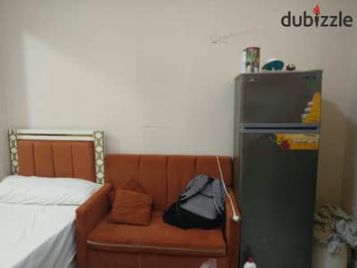 Furnished studio for rent in October, First District, including water, steps to the parking lot, and Al-Hosari and the university.