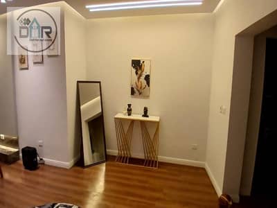 Ground-floor hotel-style apartment with a garden in the Westown SODIC compound, Beverly Hills, Sheikh Zayed.
