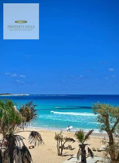 For sale in Ras Al-Hikma, a chalet with a private garden, hotel finishing, including air conditioning and kitchen