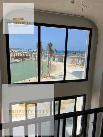 The lowest price in the market for a finished chalet with air conditioning, with a direct view of the sea and the lagoon in Ghazala Bay next to El Alamein and Hacienda White