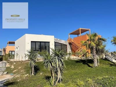 Fully finished chalet with air conditioning, prime location in the village with a stunning view on sea