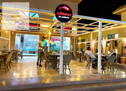 A shop with immediate occupancy, currently rented for 60,000 and operational, located in Al Rehab, Fifth Settlement.