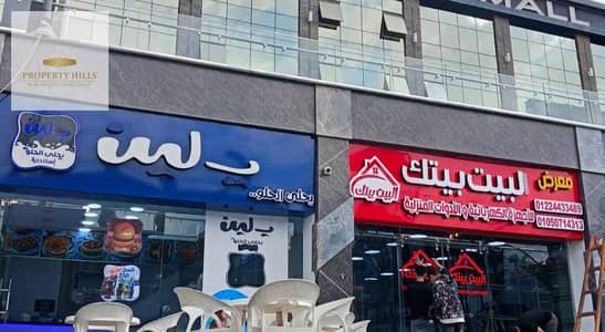 Ground floor shop for sale, immediate occupancy, generating a monthly return of 260,000. Located directly opposite the American University in New Cairo, with installment payment options available.