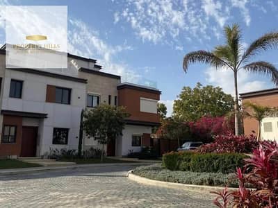 Corner Townhouse for Sale in AZZAR, 5th Settlement, with a 10-year installment plan. Open landscaped view, sharing a wall with Al Marasem.