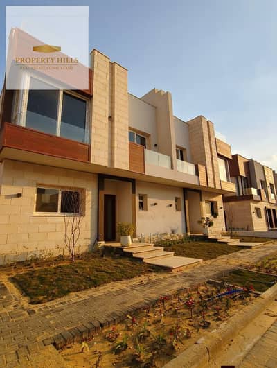 lowest price townhouse prime location greenery view with installments over 10 YEARS  IN AZZAR compound at golden square fifth Settlement in new cairo!