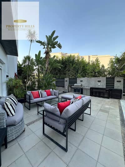 Twin House Villa finished next to Mountain View for sale with a 37% discount from its price in a villa compound only