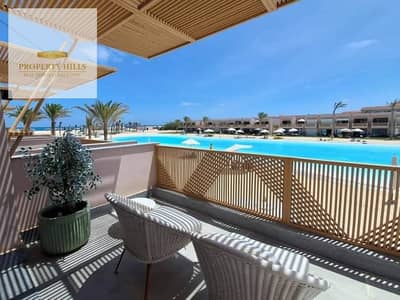 Chalet for sale in Azha Village, finished with air conditioning and kitchen, in the best location with lagoon views.