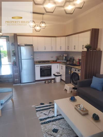 Chalet for sale 3 master rooms with lagoon view in North Coast Hills, fully finished, super lux with a 40% discount on its price for quick sale