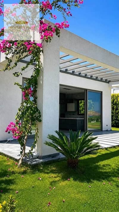 Last corner villa for sale, immediate delivery, fully finished with air conditioning and kitchen, with a direct view of the sea in Ras Al-Hekma.