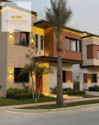 A prime villa for sale in AZZAR Compound, Golden Square, directly adjacent to Mountain View, featuring a spacious area and a private garage.