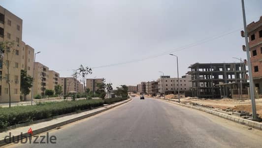  A prime investment opportunity in Badr City: a 445m² plot in the northern part of the 7th District, featuring a concrete foundation slab, offered a