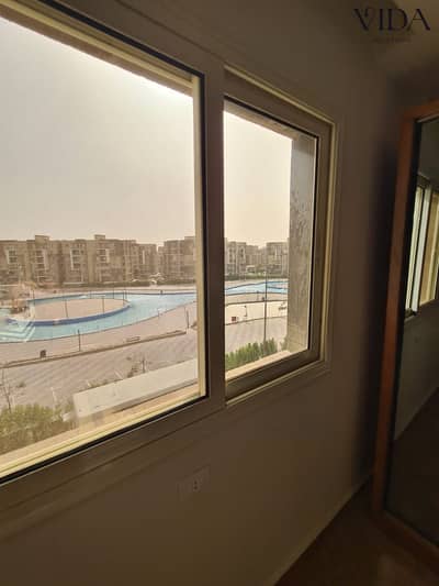 130 sqm apartment for sale in Janna October; pool view, fully finished (including A/Cs and kitchen), first-time occupancy.