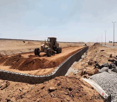 A 475 thousand advance installment for a 170 sqm apartment + 150 sqm garden second line from the airport road in front of Badiya Compound + Al Uptown near the Monorail + airport installment for 6 years