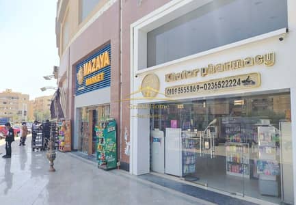 محل للبيع 100م استلام فوري بالتقسيط ب مول اكتوبر فيستيفال سيتي October Festival City ب 6 أكتوبر علي محور جمال عبد الناصر بسعر مغري جدا