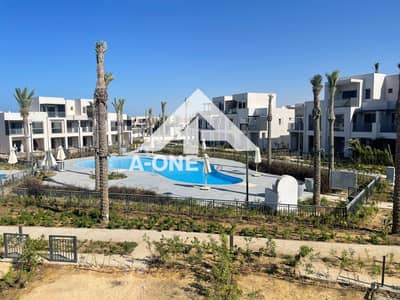 With a swimming pool view for a corner townhouse for sale in Riva ready for delivery in Riva Marassi North Coast Sidi Abdel Rahman near Hacienda Bay