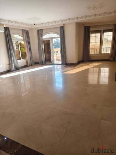 Apartment for rent in the fourth tourist area in front of Mina Garden Compound and Mall of Arabia with kitchen, air conditioning, water heaters, and curtains.