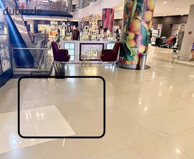 Partition space kiosk in front of the cash register of the bulk house