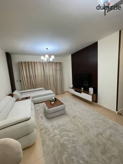 Furnished 103m² apartment for rent in Madinaty. It features 3 bedrooms, 2 bathrooms, a spacious reception area, and a fully equipped kitchen (includin