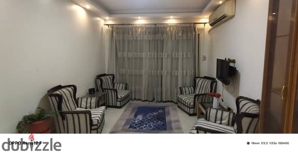 Furnished apartment for rent, Corniche Al-Maadi, Torra, Al-Ikhaa Towers, Army. It consists of two bedrooms, a reception area, a bathroom, and an air-conditioned kitchen with Wi-Fi and natural gas. Seventh floor, 2 elevators, near the metro station.