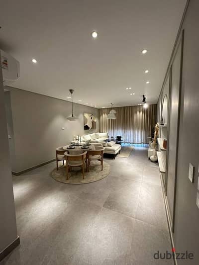 immediately a hotel unit directly on the Nile, fully finished with air conditioners, furniture, and Samsung appliances in a tower on Maadi