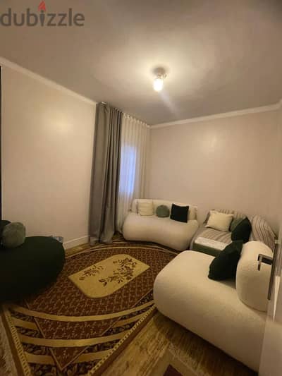 White and dark green sofa