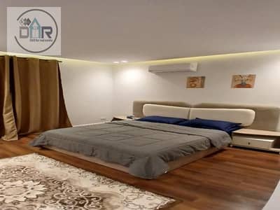 Modern, high-end furnished apartment with a private garden for rent in the Beverly Hills compound, Sheikh Zayed.