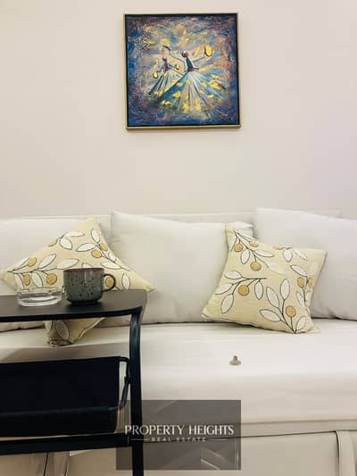 A stylish fully furnished studio in ZED West with a garden view, modern interiors, and everything ready for immediate use.
