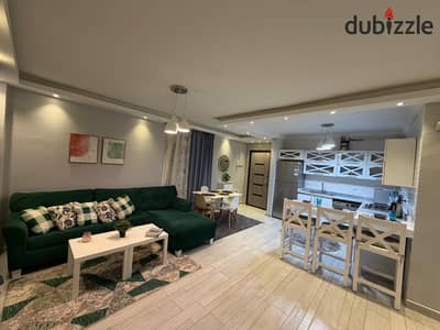 Furnished apartment for rent in Al-Rehab, first residence, fully furnished with modern furnishings and complete special finishing, 3 bedrooms, long and short terms, American kitchen, full air conditioning, complete appliances