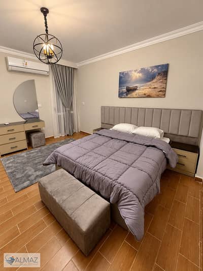 Furnished 130-square-meter apartment for rent in the Dar Misr Al-Qaranful compound, First Settlement; directly facing Gate 24 of Al-Rehab City.